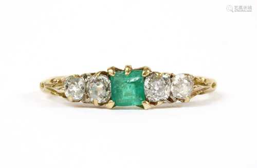 A gold emerald and diamond ring,