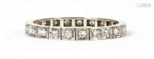 A white gold diamond full eternity ring,