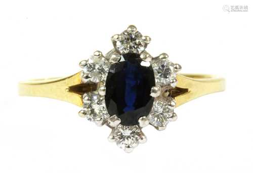 An 18ct gold sapphire and diamond cluster ring,