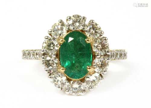 A gold emerald and diamond cluster ring,