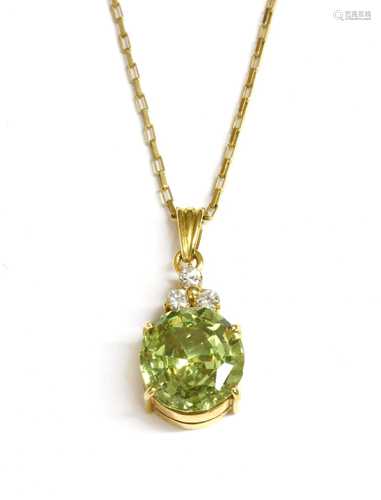 A gold sphene and cubic zirconia pendant,