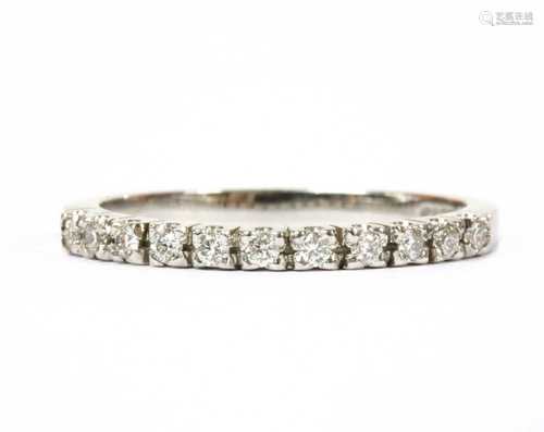 An 18ct white gold diamond half eternity ring,