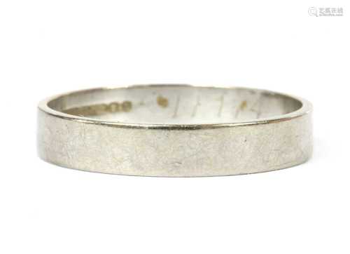 An 18ct white gold flat section wedding ring,