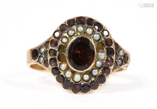 A Victorian gold garnet and split pearl cluster,