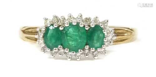 A 9ct gold emerald and diamond triple cluster ring,