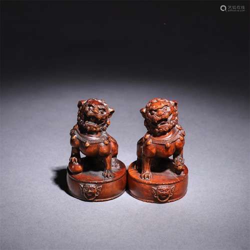 A Pair of Chinese Boxwood Carved Lion Ornaments