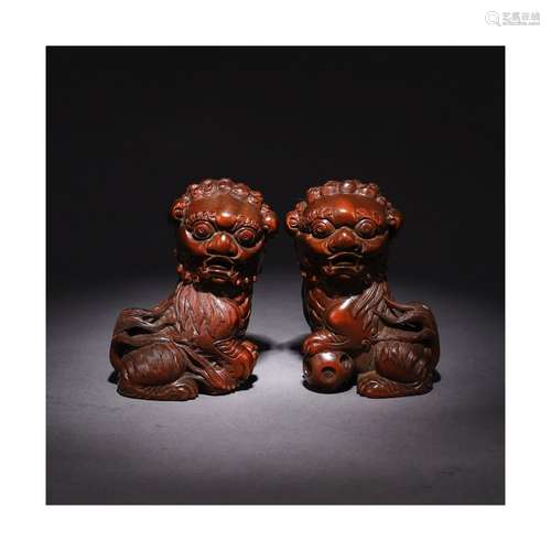 A Chinese Pair of Boxwood Carved Lion Ornaments