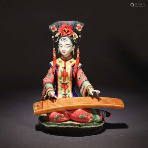 A Chinese Shiwan Kiln Beauty Statue