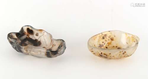 Two Chinese carved agate brush washers of leaf form, one with pierced handle, the larger 3.75ins.