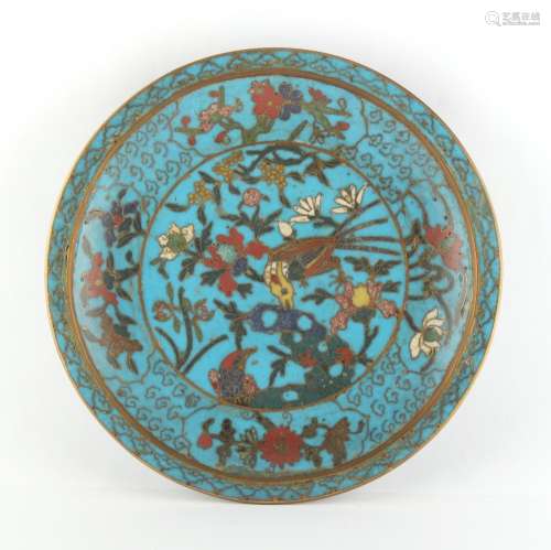 A Chinese cloisonne shallow dish, decorated with two birds among flowering shrubs & rockwork, on a
