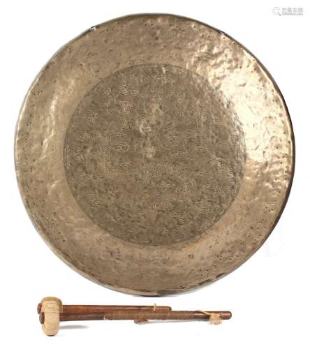 A large Chinese bronze gong, late 19th / early 20th century, with engraved decoration depicting a