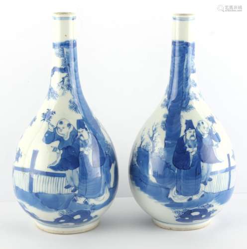 Property of a lady - a pair of 19th century Chinese blue & white bottle vases, mirror images of
