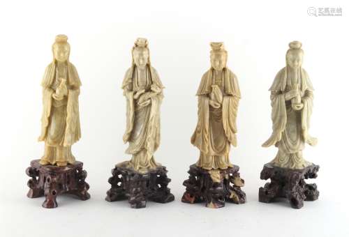 Property of a deceased estate - a group of four Chinese carved soapstone figures of Guanyin, the