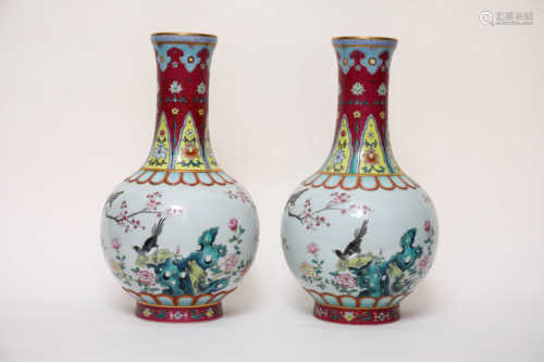 A pair of Tianqiu bottles decorated with pastel flowers and birds