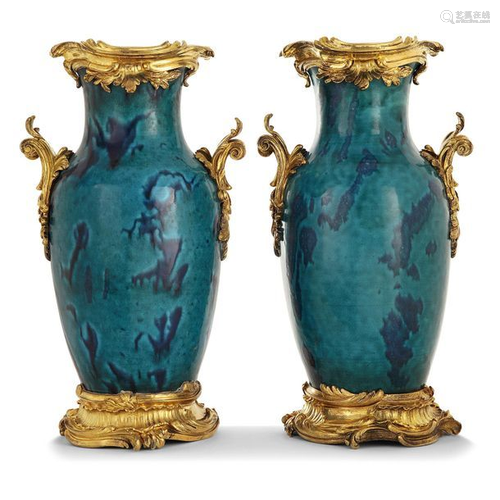 A pair of peacock blue glaze bottles