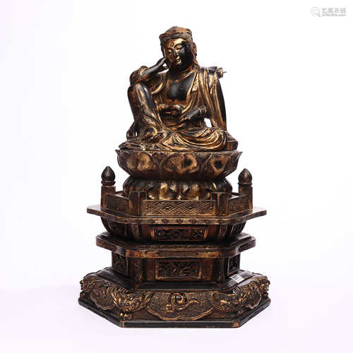 Wood carved statue of Guanyin's nine story throne