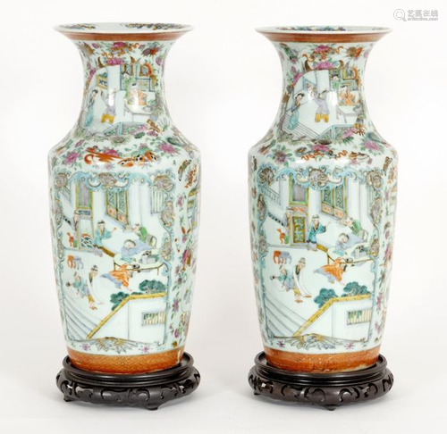 A pair of mallet bottles decorated with pastel figures