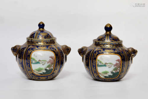 A pair of bowls with double lion ear covers decorated with landscape patterns