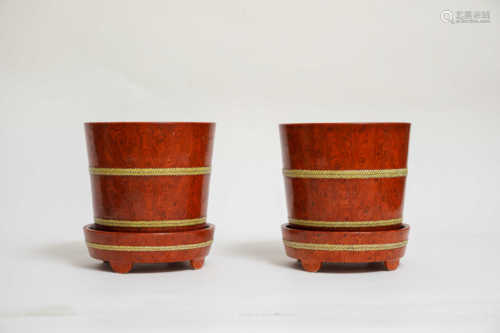 A pair of imitation wood grain flowerpots