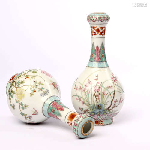 A pair of garlic bottles decorated with pink flowers and butterfly patterns