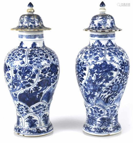 A pair of Guanyin vases decorated with blue and white flowers