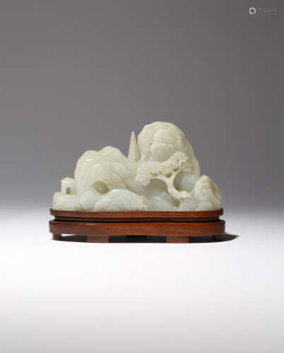 A CHINESE CELADON JADE 'MOUNTAIN' CARVING QIANLONG 1736-95 Formed as rounded craggy peaks, decorated
