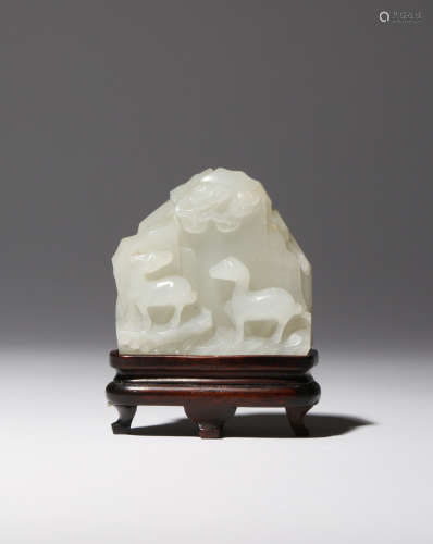 A SMALL CHINESE WHITE JADE 'MOUNTAIN' CARVING QIANLONG 1736-95 Formed as a rocky cliff face,