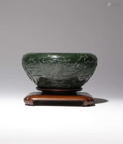 A LARGE CHINESE SPINACH-GREEN JADE 'DRAGON' BRUSH WASHER 19TH CENTURY The rounded sides carved in