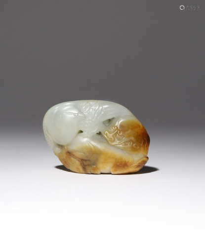A CHINESE CELADON AND RUSSET JADE 'YINGXIONG' GROUP 18TH CENTURY Carved as a recumbent lion dog