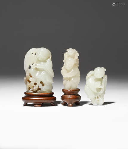 TWO CHINESE JADE CARVINGS OF LIU HAI AND A CARVING OF A BOY 18TH/19TH CENTURY The pale celadon