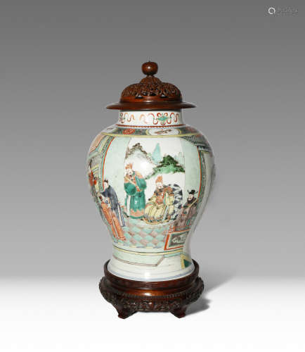 A CHINESE FAMILLE VERTE BALUSTER VASE KANGXI 1662-1722 Painted with scholar-officials and their