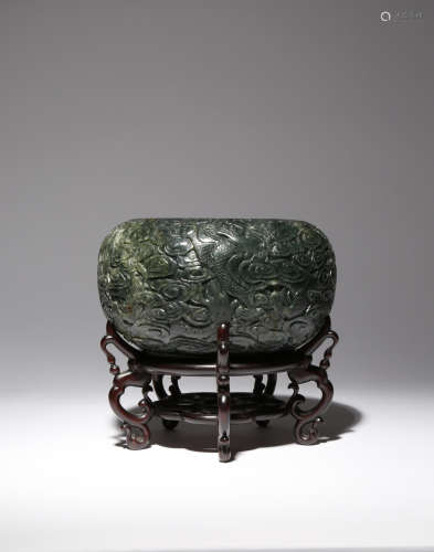 A LARGE CHINESE SPINACH-GREEN JADE 'DRAGON' BRUSH WASHER 19TH CENTURY The exterior carved in