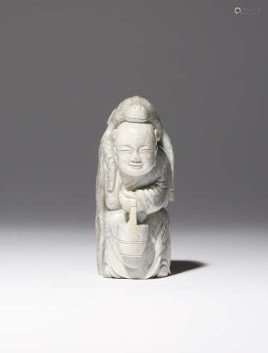 A CHINESE CHICKEN-BONE JADE CARVING OF ZHOU YANZI 18TH CENTURY The boy carved standing holding a