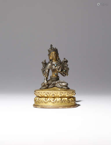 A SMALL TIBETAN SILVER FIGURE OF WHITE TARA 15TH/16TH CENTURY Depicted seated in dhyanasana