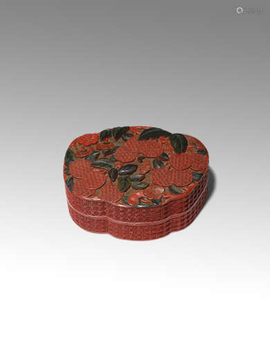 A CHINESE THREE-COLOUR CINNABAR LACQUER 'PEACHES' BOX AND COVER 18TH/EARLY 19TH CENTURY Carved in