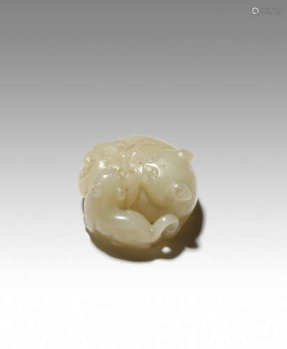 A CHINESE YELLOW JADE CARVING OF TWO CATS 18TH CENTURY The mother cat lies curled up with her head