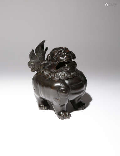 A CHINESE BRONZE 'LION DOG' INCENSE BURNER AND COVER 17TH CENTURY The stocky beast cast standing
