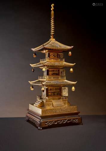 A JAPANESE KOMAI STYLE IRON MODEL OF A THREE-TIERED PAGODA MEIJI PERIOD, 19TH OR 20TH CENTURY Richly