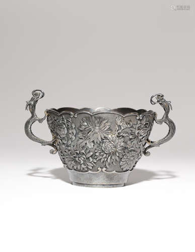 A JAPANESE SILVER BOWL MEIJI PERIOD, 19TH OR 20TH CENTURY With a lobed rim, the body decorated