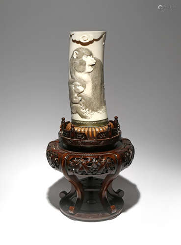 λ A LARGE JAPANESE IVORY TUSK VASE MEIJI PERIOD, 19TH CENTURY Carved in low relief with two