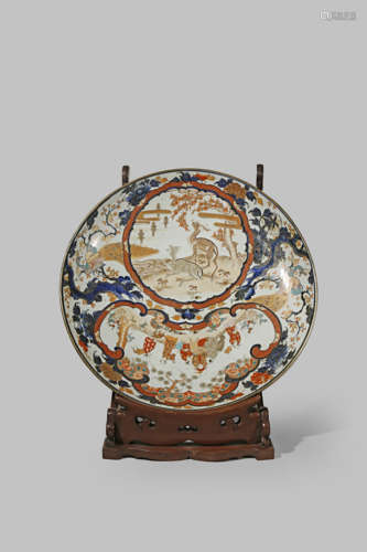 A MASSIVE JAPANESE IMARI CHARGER MEIJI PERIOD, 19TH CENTURY Decorated in underglaze blue, iron-red