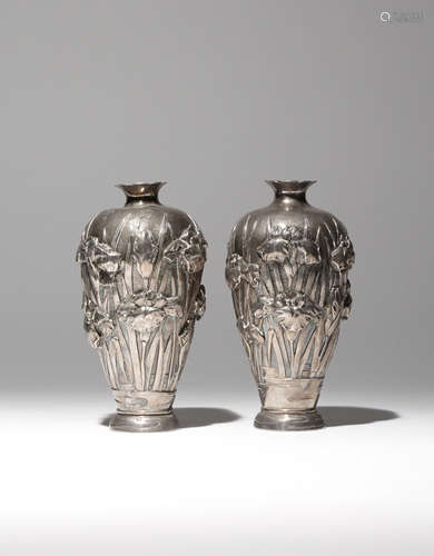 A PAIR OF JAPANESE SILVER VASES MEIJI PERIOD, 19TH CENTURY The tall baluster bodies decorated in