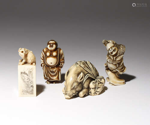 λ THREE JAPANESE IVORY NETSUKE MEIJI PERIOD, 19TH AND 20TH CENTURY One carved as a large boar