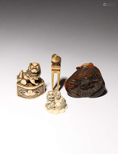 λ THREE JAPANESE IVORY NETSUKE EDO PERIOD AND LATER, 18TH CENTURY AND LATER One carved as a small