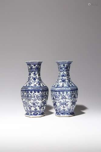 A NEAR PAIR OF CHINESE BLUE AND WHITE HEXAGONAL-SECTION VASES LATE QING DYNASTY Painted with