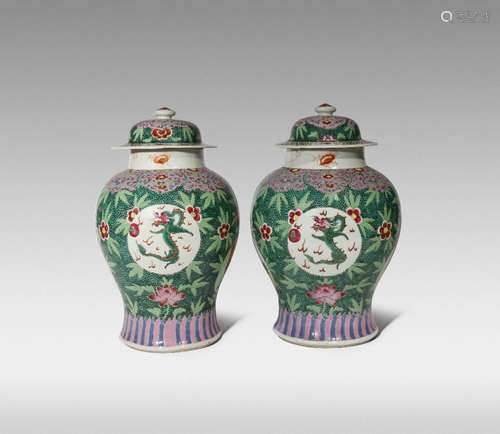 A PAIR OF CHINESE FAMILLE ROSE BALUSTER VASES AND COVERS YONGZHENG/QIANLONG Painted with