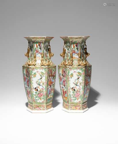 A PAIR OF CHINESE CANTON FAMILLE ROSE HEXAGONAL-SECTION VASES 19TH CENTURY Richly decorated in