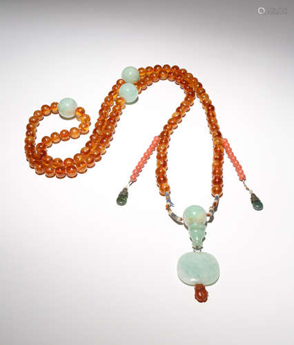 A CHINESE AMBER AND JADEITE CEREMONIAL COURT NECKLACE 19TH CENTURY The ninety-eight amber beads