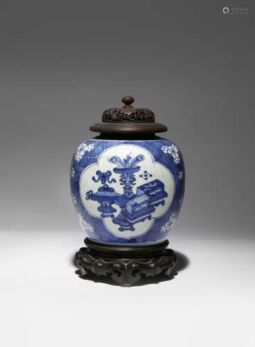 A CHINESE BLUE AND WHITE 'HUNDRED ANTIQUES' VASE KANGXI 1662-1722 Painted with two quatrefoil