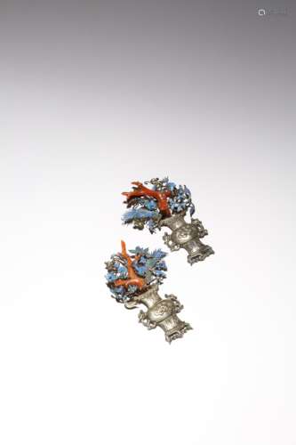 A PAIR OF CHINESE SILVER AND KINGFISHER FEATHER APPLIQUES QING DYNASTY Each formed as a vase flanked